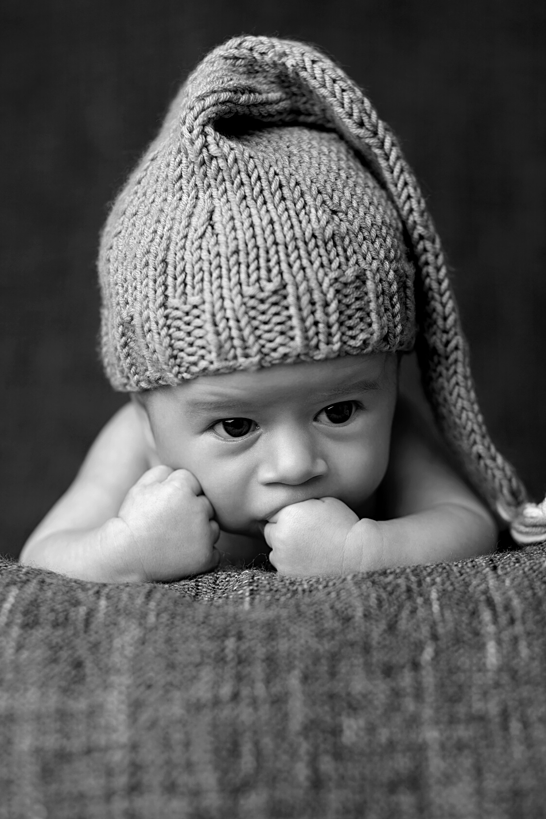 Newborn Wearing a Grey Hat